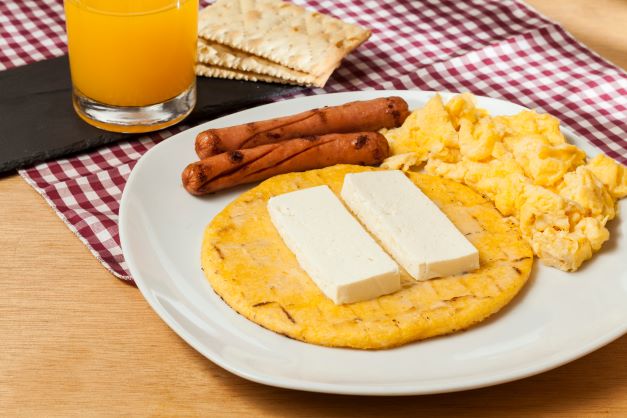 Yellow Corn Arepa with scramble eggs and sausage