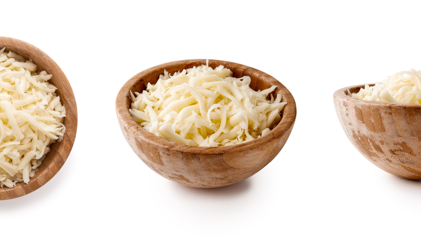 Shredded White Cheese in a Wooden Bowl