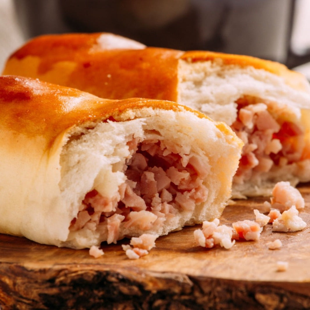 Delicious Venezuelan Cachitos: Bread filled with savory chopped ham and cheese, a mouthwatering snack
