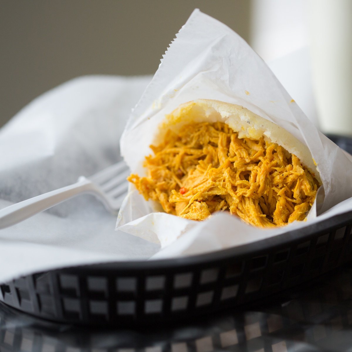Arepa filled with Paisas shredded chicken
