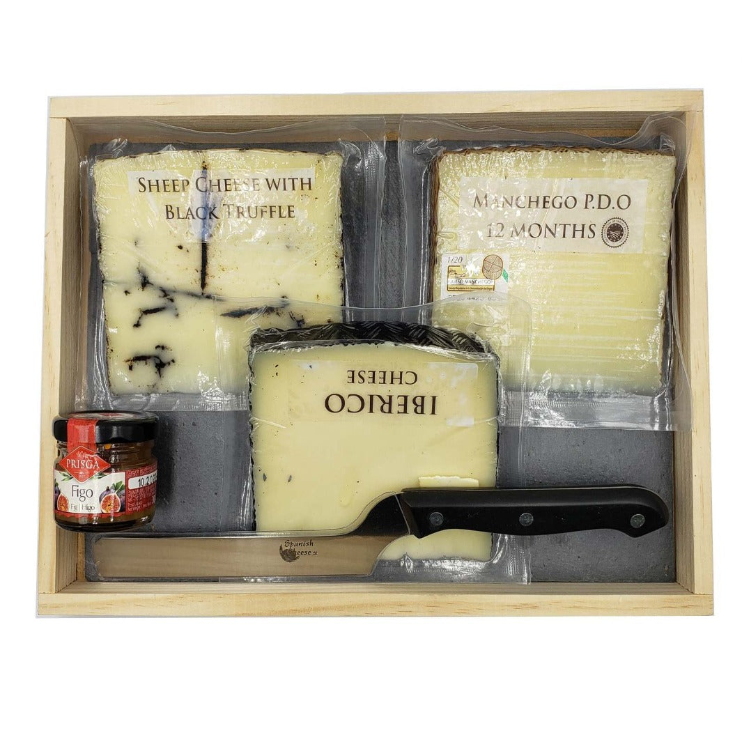 A gourmet gift set featuring an assortment of Spanish cheeses, including 12-month aged DOP Manchego Cheese, Iberico Cheese (Semi Cured), Sheep Cheese with truffle (4 months), along with a 30g jar of Fig Jam, a Pizarra Slate board, and a special cheese knife