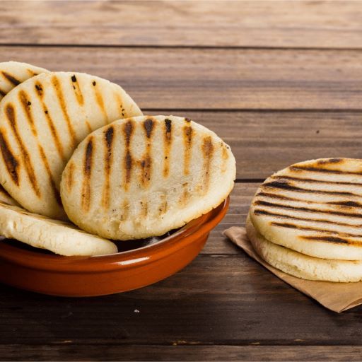 Arepas recently cooked in a brown bowl